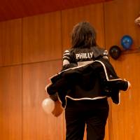 Image of President Mantella showing off her personalized GVSU jersey. Back of jersey says "Philly" a nickname for President Mantella's first name